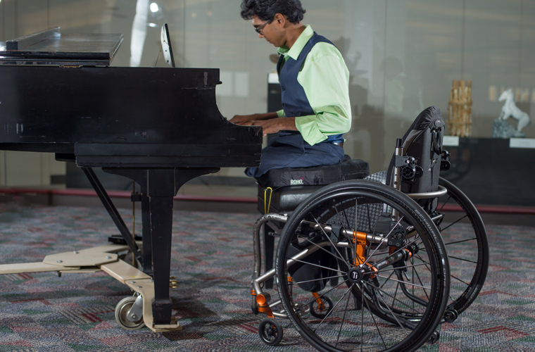 ROHO Hybrid Elite Air Cushion Being Used While Playing Piano